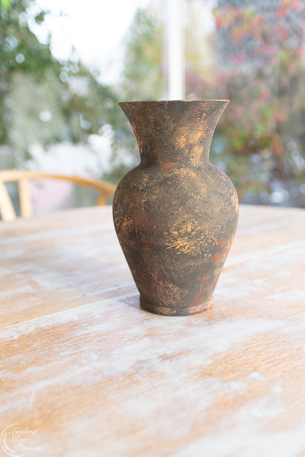 Faux Earthenware Vase Finding Silver Pennies
